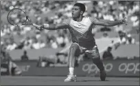  ?? JULIAN FINNEY/GETTY IMAGES ?? Carlos Alcaraz of Spain in action against Taro Daniel of Japan on Wednesday in Paris.