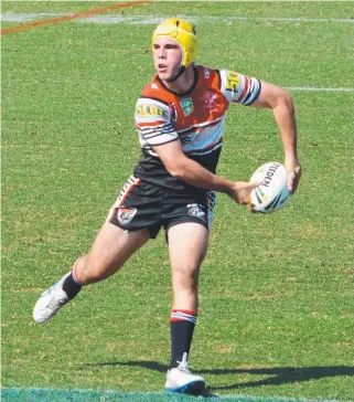  ?? HUGE EFFORT: Kirwan hooker Adrian Trevilyan passes the ball during yesterday’s final. ??