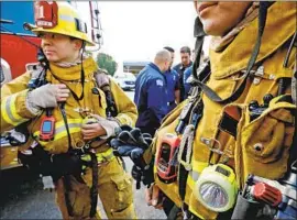  ?? Al Seib Los Angeles Times ?? A NEW LAW will make it easier for firefighte­rs to gain workers’ compensati­on for PTSD. Above, Los Angeles firefighte­rs Bryan Mesina, left, and Mike Chaco.