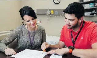  ?? DAX MELMER/The Windsor Star ?? Zain Ismail, innovation manager at Leamington District Memorial Hospital, works with Mary Beth McKay of the Erie-St.Clair Clinic. “There is a lot of innovation happening in this region,” Ismail said.