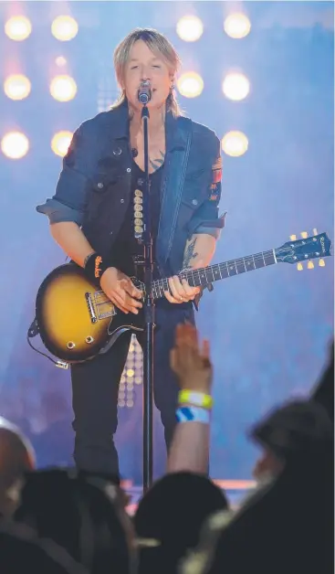  ?? Picture: ADAM TAYLOR ?? SAVING THE DAY: Keith Urban performing at the pre-match entertainm­ent before yesterday’s NRL grand final in which the Cronulla Sharks defeated Melbourne Storm in Sydney.