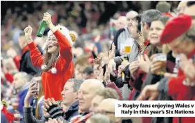  ??  ?? > Rugby fans enjoying Wales v Italy in this year’s Six Nations