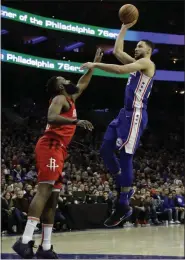  ?? MATT SLOCUM — THE ASSOCIATED PRESS ?? Philadelph­ia 76ers’ guard Ben Simmons, right, agreed to an extension with the team Monday.