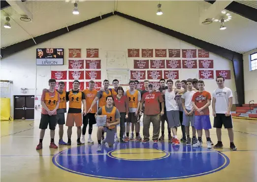  ?? BY LAURA CARTER ?? In keeping with tradition, the Jon Lee Memorial Silver Bucket Game was held at WCDS on December 26. This game, in which alumni players challenge current student-athletes, honors the legacy of Wakefield Country Day School's first basketball coach, Jon...