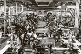  ?? Associated Press file photo ?? Workers at auto plants such as Ford’s F-150 factory in Dearborn, Mich., fear that holes in companies’ safety nets to protect against COVID-19 will be exposed as production volumes rise.