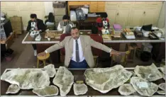  ??  ?? In this Saturday photo, Hesham Sallam, head of Mansoura university’s Center for Vertebrate Paleontolo­gy, displays bones of a Cretaceous period dinosaur in Mansoura, Egypt. AP PHOTO/AMR NABIL