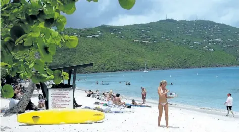  ?? JIM FOX/ SPECIAL TO POSTMEDIA NEWS ?? Life’s still a beach at most places across the Caribbean, including Magens Bay on St. Thomas, Virgin Islands.