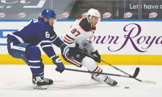  ?? CLAUS ANDERSEN/GETTY IMAGES ?? Oilers captain Connor Mcdavid was held to a single assist Wednesday night, but the team delivered a strong defensive effort to down the Maple Leafs 3-1.