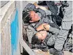  ?? AFP YOSSI ZAMIR ?? ISRAELI police officers react after being hit by a car in a ramming attack in the Sheikh Jarrah neighbourh­ood of Israeli-annexed east Jerusalem, on Sunday. |