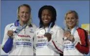  ?? PETR DAVID JOSEK — THE ASSOCIATED PRESS ?? United States’ gold medal winner Simone Manuel is flanked by Sweden’s silver medal winner Sarah Sjostrom, left, and Denmark’s bronze medal winner Pernille Blume, right, after the women’s 100-meter freestyle final during the swimming competitio­ns of the...