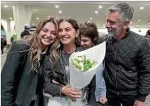  ??  ?? Nadia, second from left, with her sister Millie and parents, Margie and Paul Rees, after landing at Christchur­ch Airport from Australia.