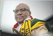  ?? Mujahid Safodien AFP/Getty Images ?? EVAN MAWARIRE set off a grass-roots protest movement with his impassione­d video about Zimbabwe’s f lag. He later f led to South Africa.
