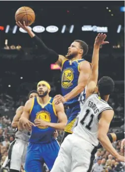  ?? Eric Gay, The Associated Press ?? Warriors guard Stephen Curry tries to score Monday night against Bryn Forbes and the Spurs as JaVale McGee, a former Nuggets center, looks on during Game 4 of the NBA’s Western Conference finals in San Antonio.