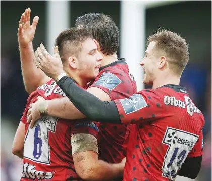  ?? PICTURE: Getty Images ?? Rout: Jake Polledri, left, celebrates with teammates after scoring his late try