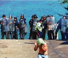  ?? AFP ?? Riot police confront students protesting against Nicolas Maduro’s government in San Cristobal, Venezuela.