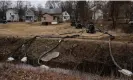  ?? Photograph: Michael Swensen/Getty ?? A crew works alongside a stream as clean-up efforts continue in East Palestine, Ohio.