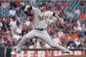  ?? MICHAEL WYKE — THE ASSOCIATED PRESS ?? A’s starting pitcher Cole Irvin winds up during the first inning Thursday against the Houston Astros in Houston.