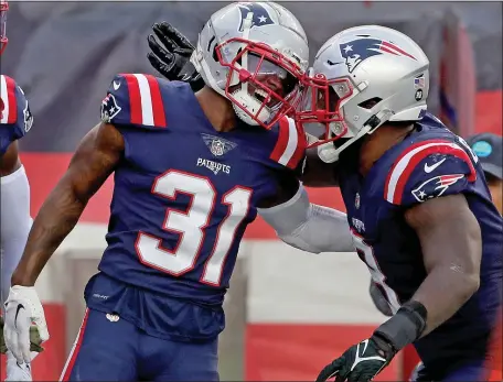  ?? MATT STONE — BOSTON HERALD ?? Patriots defensive back Jonathan Jones, left, celebrates his touchdown with Ja’Whaun Bentley during a Nov. 6, 2022 game in Foxboro against the Indianapol­is Colts.