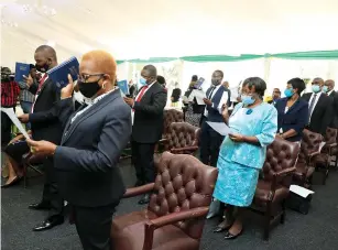  ??  ?? Commission­ers take their oaths of office during a swearing-in ceremony presided over by President Mnangagwa at State House in Harare yesterday