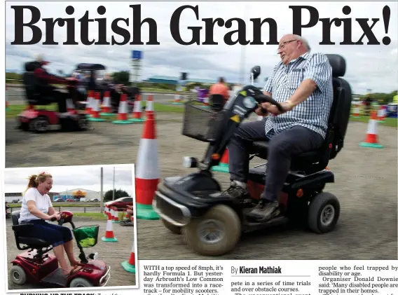  ??  ?? BURNING UP THE TRACK: Two of the disabled competitor­s who took part in yesterday’s Mobility Scooter Wacky Races in Arbroath