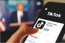  ?? Bloomberg ?? The TikTok app is seen on a mobile phone. The CEO of ByteDance has said the company is in negotiatio­ns with another tech firm, without naming Microsoft directly.
