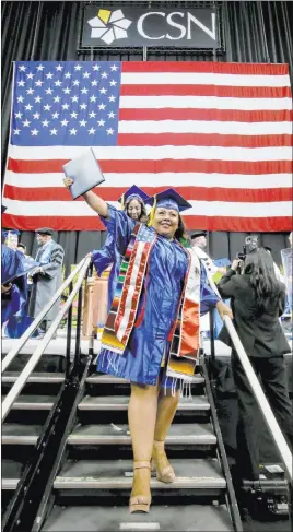  ?? K.M. Cannon Las Vegas Review-journal @Kmcannonph­oto ?? School of Business graduate Polly Flores celebrates after walking across the stage Monday during the College of Southern Nevada commenceme­nt ceremony at the Thomas & Mack Center.