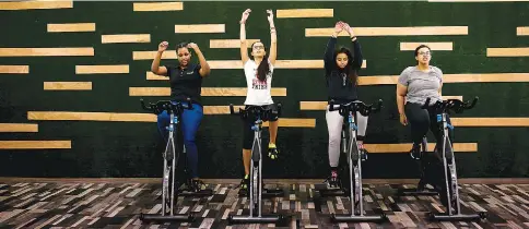  ?? — WP-Bloomberg photos ?? Saudi women attend a spinning class at Kore Studio in Riyadh, Saudi Arabia in October 2016.