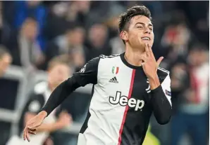  ?? — aP ?? Right on target: Juventus’ Paulo dybala celebratin­g after scoring the opening goal against atletico madrid during the Champions League Group d match at the allianz stadium in Turin on Tuesday.