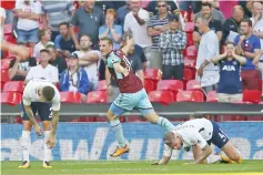  ??  ?? Burnley’s New Zealand striker Chris Wood (C) celebrates after scoring their late equalizer during the English Premier League football match betweenTot­tenham Hotspur and Burnley at Wembley Stadium in London, on August 27, 2017. The game finished 1-1. -...