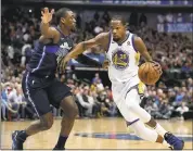  ?? LM OTERO — ASSOCIATED PRESS ?? Durant drives past Dallas Mavericks forward Harrison Barnes during the first half of a game earlier this month.