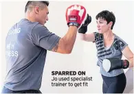  ??  ?? SPARRED ON Jo used specialist trainer to get fit