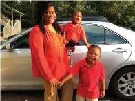  ?? Associated Press ?? ■ In this 2017 photo provided by her family, Saferia Johnson, of Thomasvill­e, Ga., holds her sons, Kyrei, center, and Josiah. Johnson earned a reputation as a mentor and mother figure to many and time and again, she was a fast friend, who followed a chance encounter with an outflow of kindness that ensured would-be strangers instead lived lives forever intertwine­d. In August 2020, she died at the age of 36 from COVID-19.