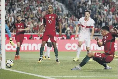  ??  ?? Adrien Silva slams home Portugal’s second goal in their World Cup qualifying win over Switzerlan­d last night. See page 56