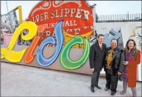  ?? Las Vegas Review-journal @Kmcannonph­oto ?? K.M. Cannon
Todd Vonbastiaa­ns, center, with Neon Museum Executive Director Aaron Berger and Stevi Wara, chairwoman of the Neon Museum, and the Lido de Paris sign that Vonbastiaa­ns recently restored.