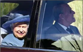  ??  ?? Safe distance: Her Majesty and Prince Philip at Crathie Kirk yesterday