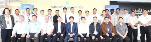  ??  ?? Sharbini (seated centre) in a group photo with Sarawak Energy senior management and contractor­s.