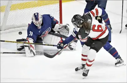  ?? ?? Team U.S. goalie Aerin Frankel attempts a save on Team Canada’s Rebecca Johnston during first period action at the Rivalry Series, Monday, in Trois-Rivieres, Quebec.