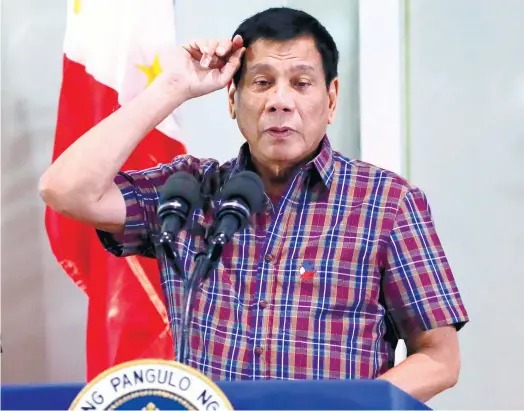  ?? (AP FOTO) ?? MAKING A POINT. In a photo taken last August, Philippine President Rodrigo Duterte addresses overseas Filipino workers who were repatriate­d to the country. While his recent statements against several internatio­nal figures have made some investors wary,...