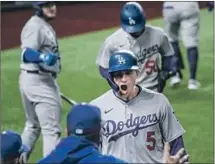  ?? Robert Gauthier Los Angeles Times ?? COREY SEAGER RETURNS to the dugout in the seventh inning after hitting his second home run of the game.