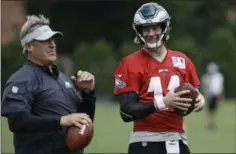  ?? MATT ROURKE — ASSOCIATED PRESS ?? Once again Eagles coach Doug Pederson, left, got a little testy when asked about the status of quarterbac­k Carson Wentz, right, who still has not been cleared to play.