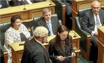  ?? KEVIN STENT/STUFF ?? Jacinda Ardern swears her oath of allegiance after the 2017 general election.