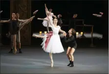  ?? ALEXANDER ZEMLIANICH­ENKO — THE ASSOCIATED PRESS ?? Dancers Alyona Kovalyova and Georgy Gusev perform during a rehearsal of Maurice Bejart’s “Gaiete Parisienne” at the Bolshoi Theater in Moscow last month.