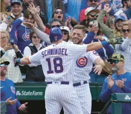  ?? NAM Y. HUH/AP ?? Frank Schwindel celebrates with Patrick Wisdom after hitting a solo home run during the eighth inning against the Arizona Diamondbac­ks on Sunday.