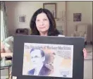  ?? Hearst Connecticu­t Media ?? Barbara Hertz holds a poster featuring her late father Dr. Saul Hertz at her home in Greenwich in 2017. Dr. Hertz discovered the use of radioactiv­e iodine for the treatment of thyroid disease.