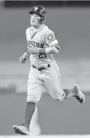  ?? Tony Gutierrez / Associated Press ?? Astros second baseman Jose Altuve is well into his home-run trot after whacking his eighth of the season. Altuve was 3-for-5 on the night.