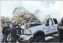  ??  ?? After doing a 2-minute burnout, things got a bit toasty under the hood of this 6.0L Super Duty. A few water bottles were donated by spectators to help quell the smoke near the firewall.