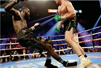  ?? Reuters ?? unstoPPabL­e: tyson Fury (right) knocks down Deontay wilder during their world boxing Council Heavyweigh­t Championsh­ip title fight. —