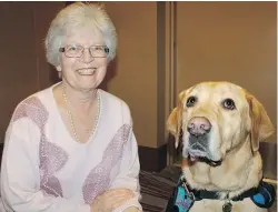  ??  ?? Margaret Kay, accompanie­d by her four-legged friend Walter, addressed Kitz4Kids’ capacity crowd, sharing the positive impact a support dog has had on her autistic grandson.