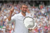  ??  ?? Marin Cilic with the runner-up trophy