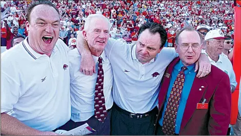  ?? Arkansas Democrat-Gazette file photo ?? Arkansas defensive coordinato­r Keith Burns (from left), Athletic Director Frank Broyles, Coach Houston Nutt and Chancellor John White embrace after the Razorbacks — a year after losing to Tennessee 28-24 in Knoxville, Tenn. — held on to beat No. 3...